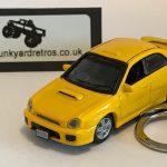 SUBARU IMPREZA KEYRING / KEYCHAIN 1/72 SCALE YELLOW