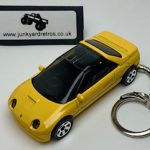 MAZDA AUTOZAM AZ-1 1992 KEYRING / KEYCHAIN 1/56 SCALE YELLOW