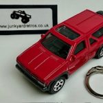 NISSAN PATHFINDER 1985 KEYRING / KEYCHAIN 1/56 SCALE RED
